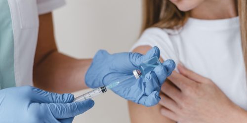 doctor-with-gloves-preparing-vaccine-woman (1)